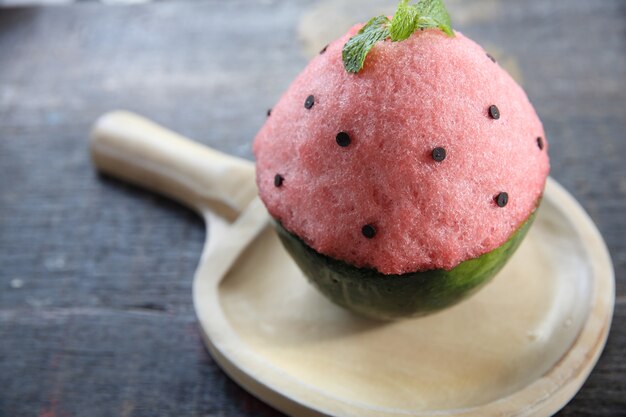 Shaved ice on wood background