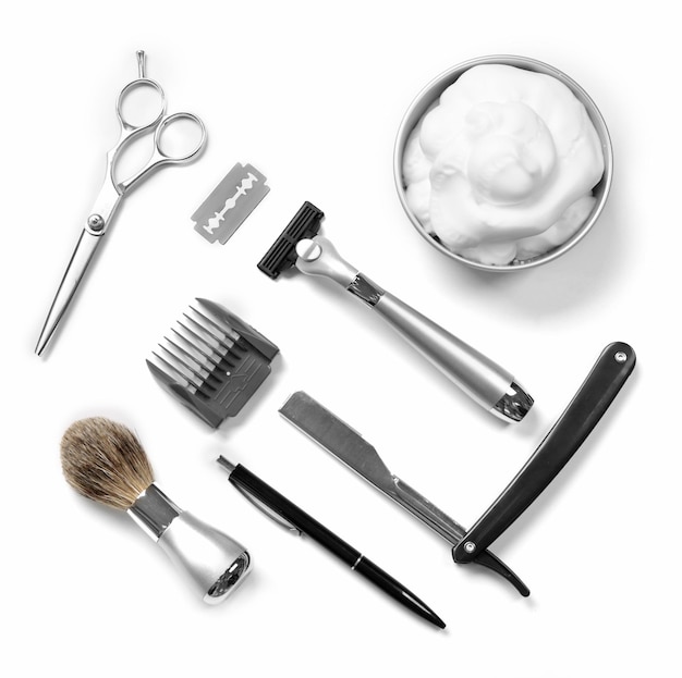 Shaving set with equipment tools and foam isolated on white