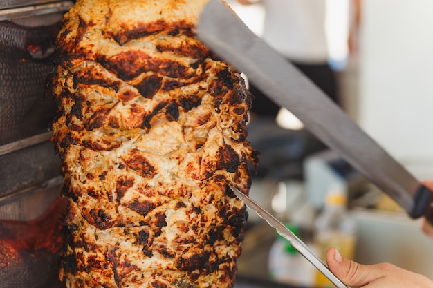 Shawarma meat being cut