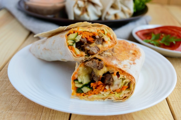 Shawarma stuffed with grilled meat, sauce, vegetables