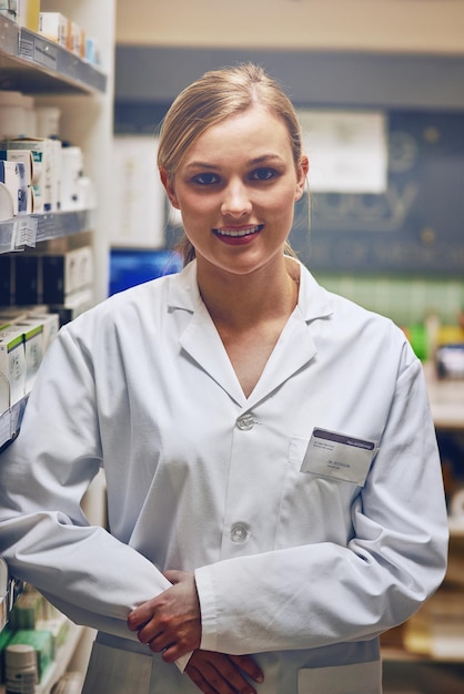 She has a compassionate helpful attitude Shot of an attractive young woman working in a pharmacy