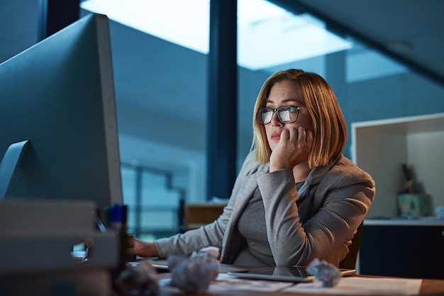 She just wants to get done Cropped shot of a businesswoman working late at night in her office