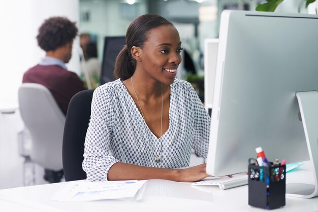 She thoroughly enjoys her job Shot of a businesswoman working in an office