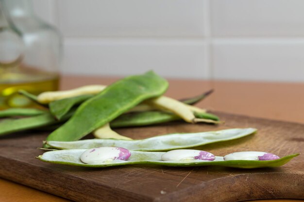 Sheaf of open garrofon with raw beans