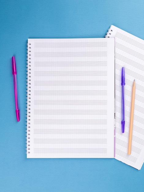 Sheet music book on blue table closeup