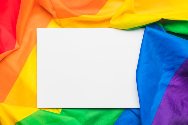 Sheet of paper on multicolored flag