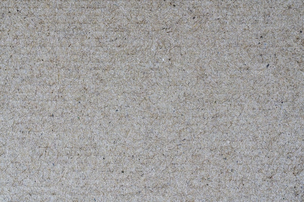 Sheet of recycled cardboard brown textured background