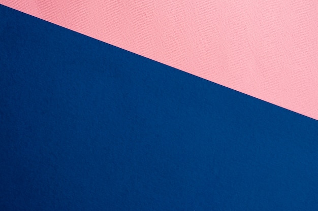 Sheets of colored paper background. blue, pink.