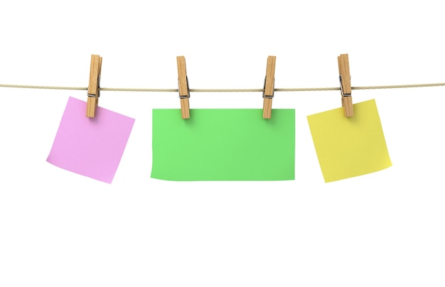 Photo sheets of paper of different colors attached to a rope with clothespins