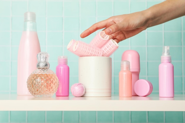 A shelf in the bathroom with care products