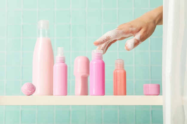 A shelf in the bathroom with care products