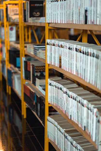 A shelf of books with the word library on the top shelf.