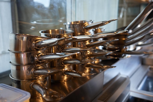 Shelf full of pans all in chrome