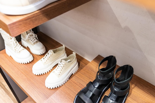 Shelf with fashionable women's shoes in the store