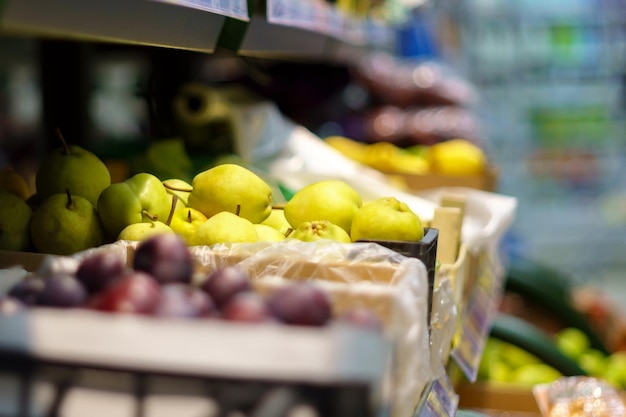 Shelf with fruits on a farm market Green Pears selective focus