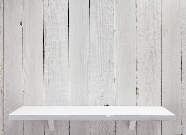 Shelf at wooden background texture wall