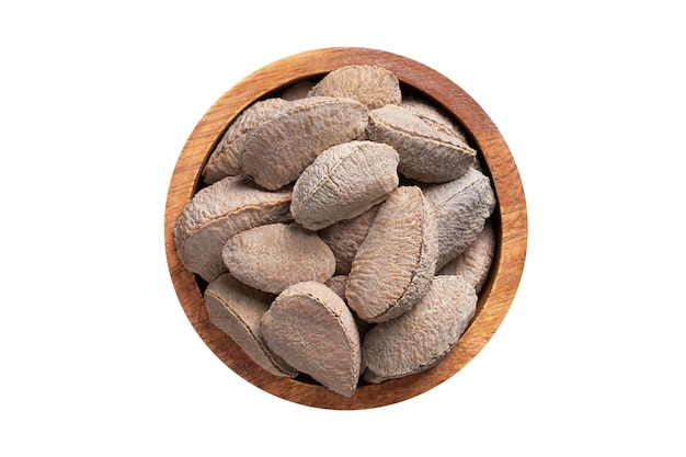 Shelled bertholletia brazil nuts in wooden bowl isolated on white background Vegan food top view