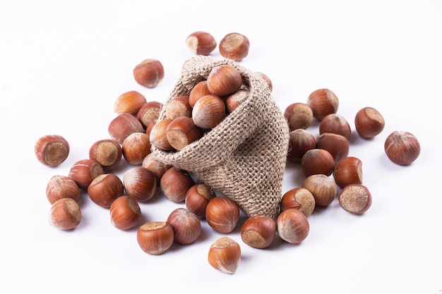 Shelled hazelnuts on the white background