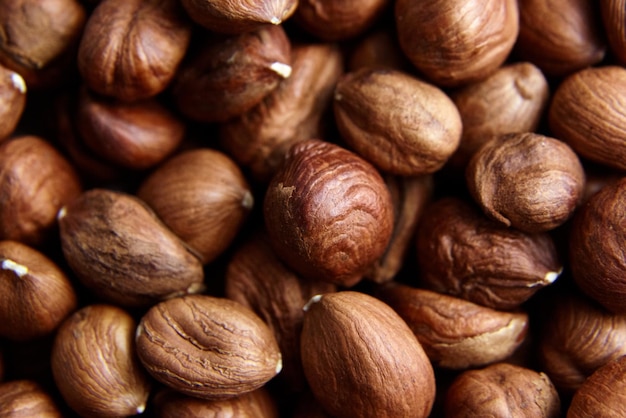 Shelled raw hazelnuts background closeup