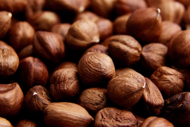 Shelled raw hazelnuts background closeup