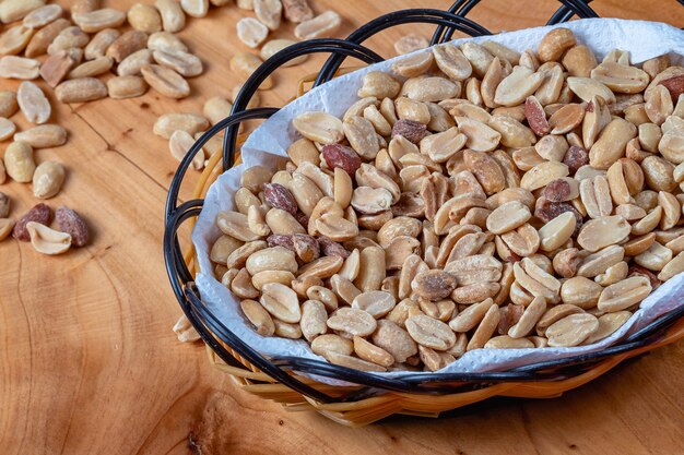 Shelled and roasted peanuts in a small basket