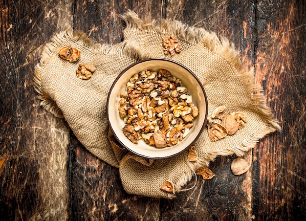 Shelled walnuts on wooden table