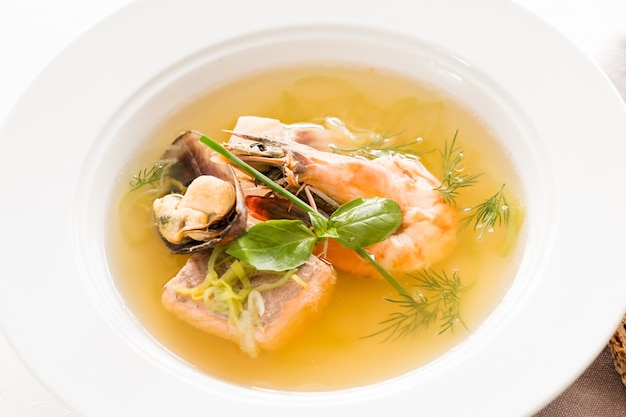 Shellfish delicacy soup. Cooking gourmet meal concept.