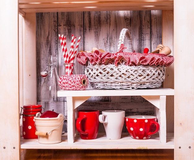 Photo shelves in the rack in the kitchen at shabby chic style