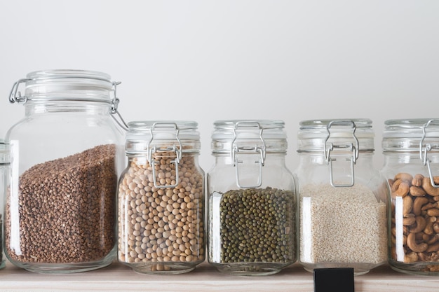 Shelves with glass jars filled with groceries