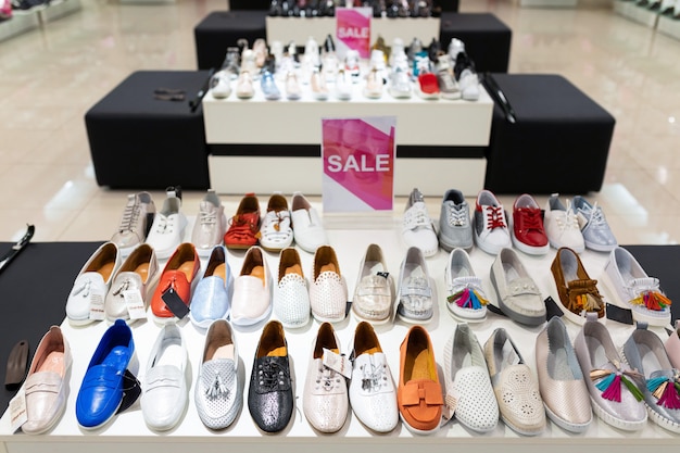 Premium Photo | Shelves with shoes and boots for women