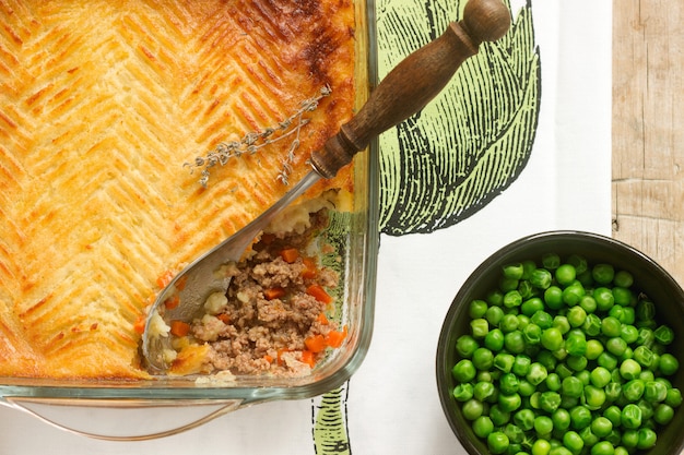 Shepherd's pie or cottage pie is a meat pie with a topping of mashed potato.