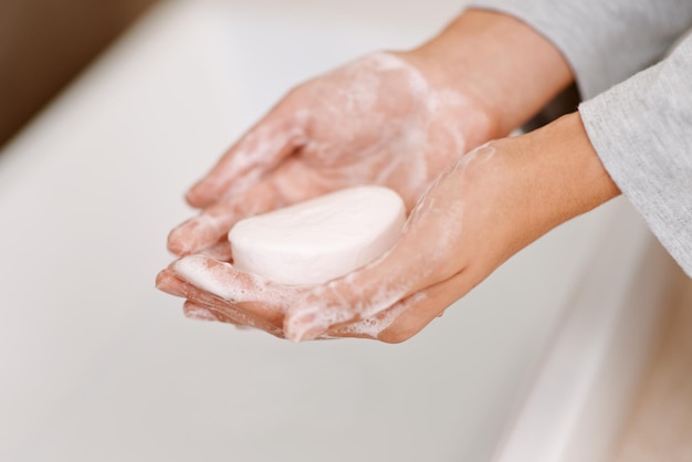 Shes germfree now Cropped shot of a woman washing her hands with soap