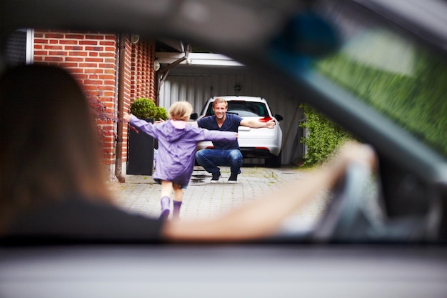 Shes happy to be home Shot of a little girl running towards her father