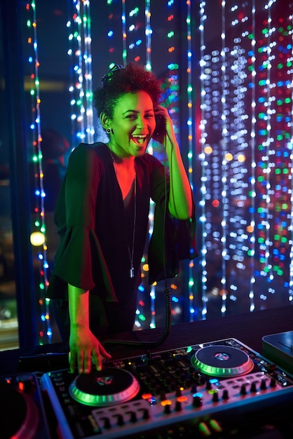 Shes the headline act Portrait of an attractive young female dj playing in a nightclub