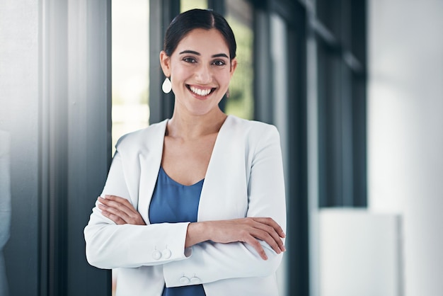 Shes the perfect blend of confidence and positivity Portrait of a successful businesswoman standing with her arms folded in the office