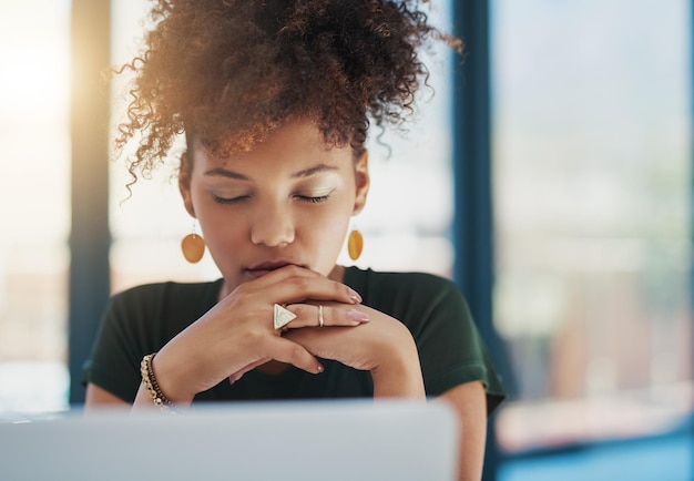 Shes put a lot of effort into this project Shot of a young businesswoman sitting at her desk