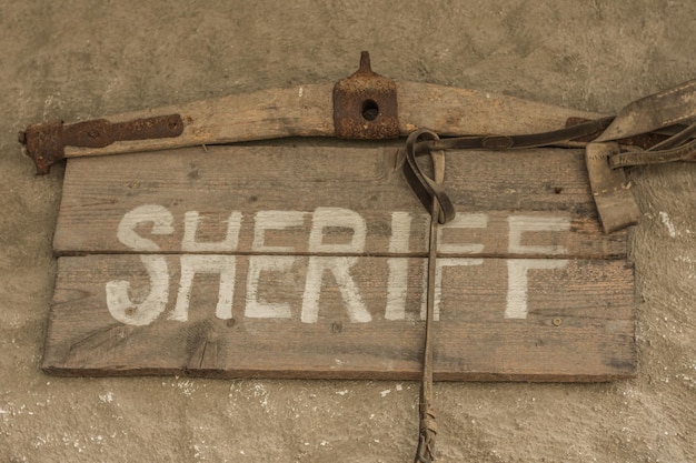 Shield with sheriff on a wall from a house