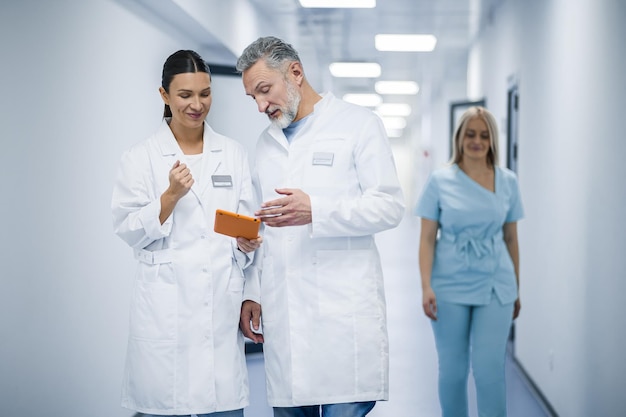 Shift change Group of doctors in the clinic corridor