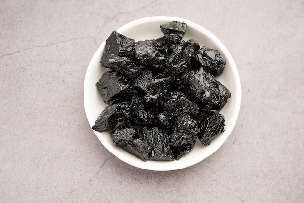 Shilajit is an ayurvedic medicine found primarily in the rocks of the Himalayas selective focus