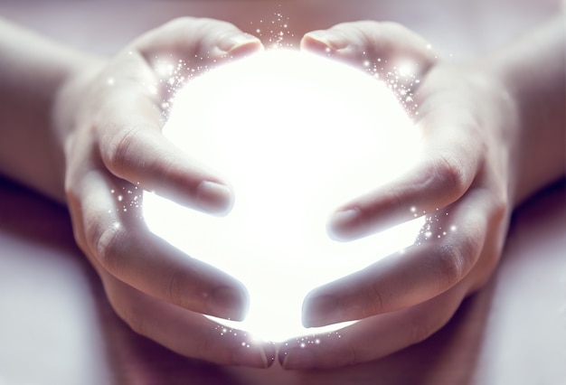 Photo shining ball in human hands