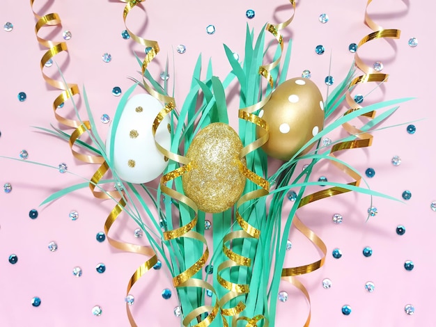 Shining composition of three golden and white eggs, grass, ribbon and sequins on pastel pink background. Advertising content for the Easter holiday. Flat lay, top view, copy space