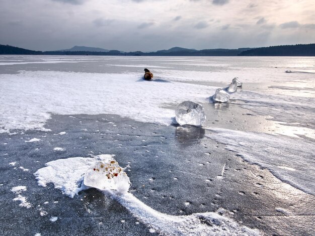 Shining shards of broken ice abstract still life of ice floes on lavel of frozen lake