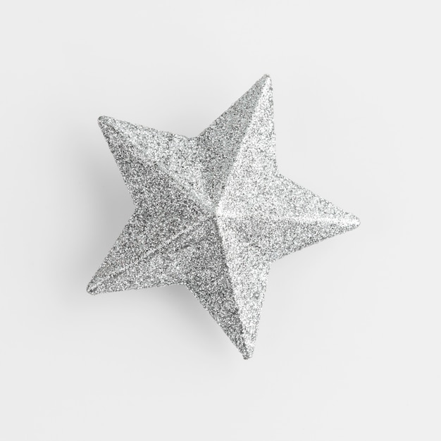 Shining silver star in white