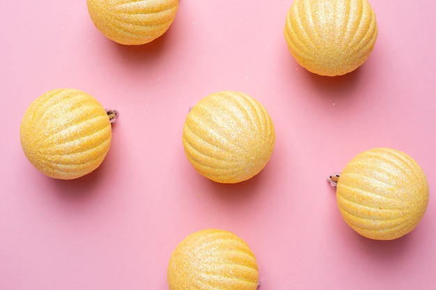 Shiny balls on a pink background for Christmas decorations