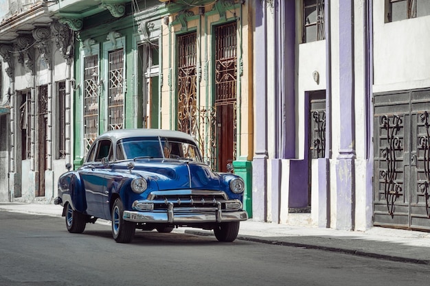 Shiny blue retro car parked on the street of Havana Cuba