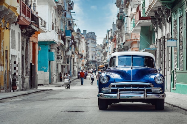 Shiny blue retro car parked on the street of Havana Cuba