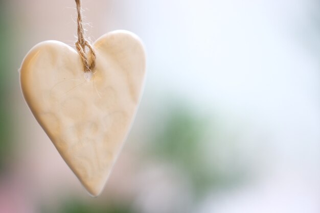 Shiny ceramic Christmas heart on a string