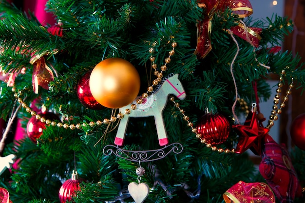 Shiny Christmas balls hanging on pine branches