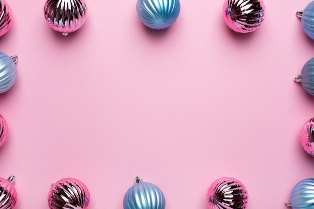 Shiny Christmas blue and pink balls for decoration on pink