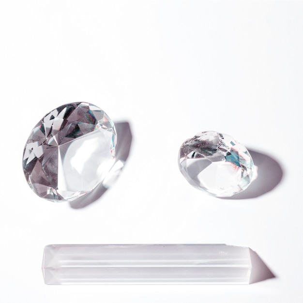 Shiny diamond in round and prism shape on white background